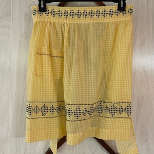 Springtime Vintage Handmade Gingham Apron with yellow and white checks and hand cross stitching in black at the hem and the pockets.