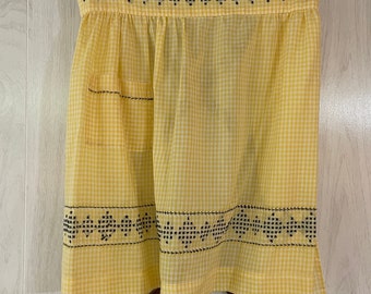 Springtime Vintage Handmade Gingham Apron with yellow and white checks and hand cross stitching in black at the hem and the pockets.