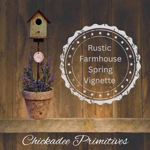 May include: A rustic farmhouse spring vignette featuring a small birdhouse with a green roof and a potted plant with purple flowers. The birdhouse is on a metal stand and the pot is made of brown ceramic. The background is a wooden wall with a white circle that says "Rustic Farmhouse Spring Vignette".