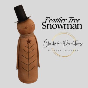 May include: A handcrafted snowman doll with a black top hat and a star on its chest. The doll is brown with a stitched tree design and a jute scarf. The text "Feather Tree Snowman" and "Chickadee Primitives" are also visible.