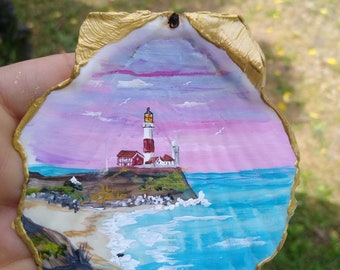 Your favorite lighthouse on a seashell with your inscription.