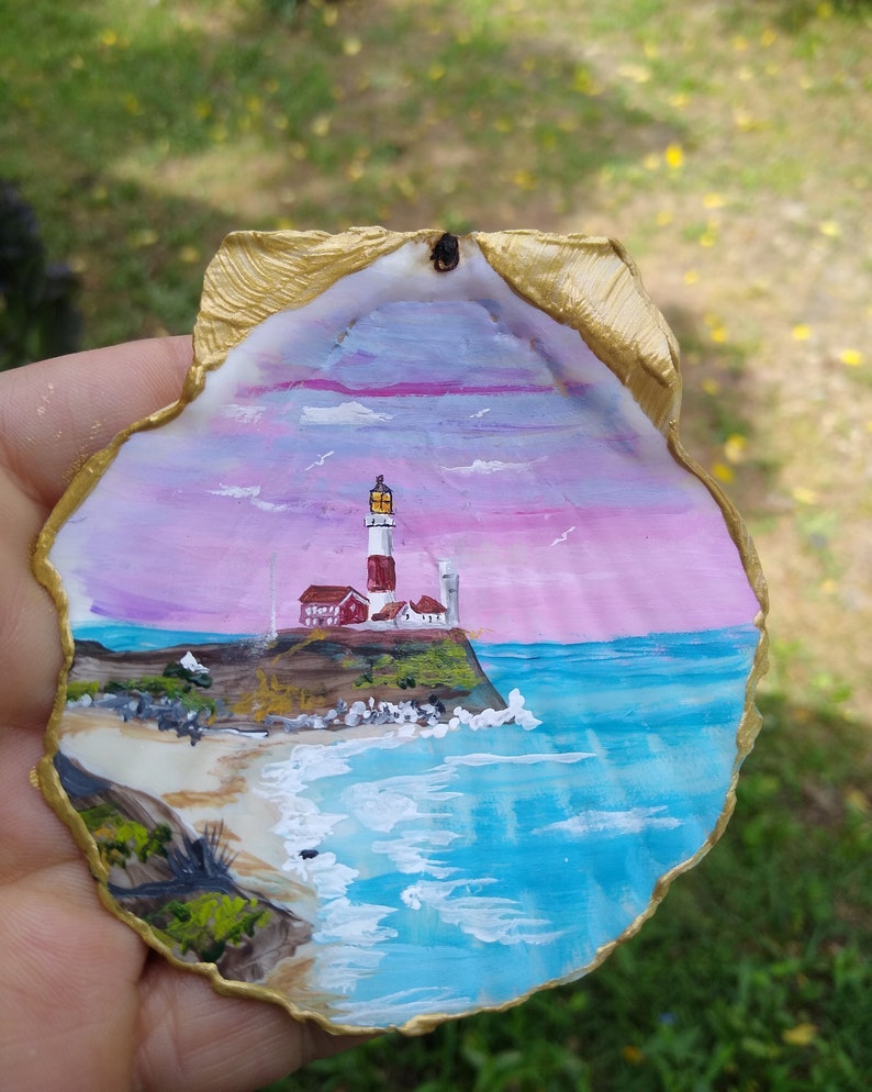 Your favorite lighthouse on a seashell with your inscription. image 1