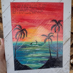 Hand painted raised wooden plaque with sunset, dolphins, palm trees and scripture.