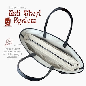 K&ouml;nnte beinhalten: Eine schwarze Tragetasche mit einem Rei&szlig;verschluss-Oberteil, das Taschen zum sicheren Verstauen von Wertsachen verbirgt. Die Tasche hat ein wei&szlig;es Innenfutter und schwarze Ledergriffe. Der Text "Extraordinary Anti-Theft System" ist &uuml;ber dem Bild angezeigt.