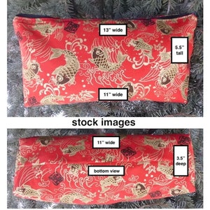 May include: Red zippered pouch with a gold koi fish pattern. The pouch measures 13 inches wide, 11 inches long, and 5.5 inches tall.