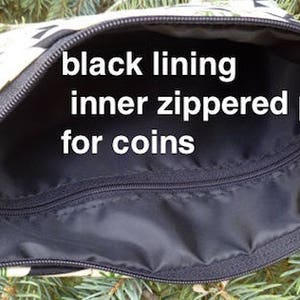 May include: Open view of a zippered pouch with a black interior and an inner zippered pocket. The pouch has a black zipper and a patterned exterior with black and white leaf designs. Text on the image reads: "black lining inner zippered pocket for coins."