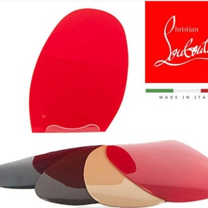 May include: Four pairs of red, brown, gray, and beige shoe soles with the Christian Louboutin logo and "Made in Italy" text.