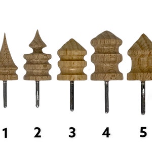 May include: Five wooden tools with different shaped heads and metal pins. The tools are numbered 1 through 5.