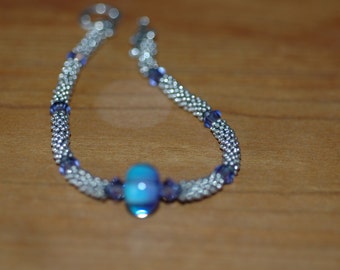 Tons of sterling silver beads with Corina Tettinger focal and swarovski accents