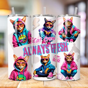 May include: Three white stainless steel tumblers with a colorful design featuring cartoon cats wearing sunglasses and hoodies. The text "Cat Crew ALWAYS FRESH" is displayed on the tumblers. Each tumbler has a silver straw.