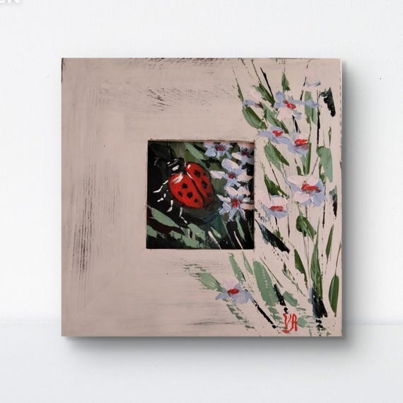 手作りのてんとう虫の絵画：ペイントされたフレーム付きの花のアクリル