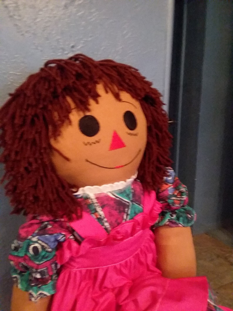 black raggedy ann doll with red hair