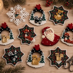 May include: A collection of ten embroidered Christmas ornaments featuring various designs including a white snowflake with a bunny, star-shaped motifs with foxes, squirrels, and skunks, and a Santa Claus figure, accompanied by metal scissors.