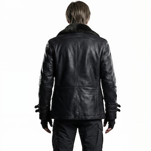 May include: Black leather jacket with a fur collar, seen from the back. The jacket has a tailored fit, with visible stitching and buckle details on the sleeves. The person is wearing black gloves and black cargo pants.