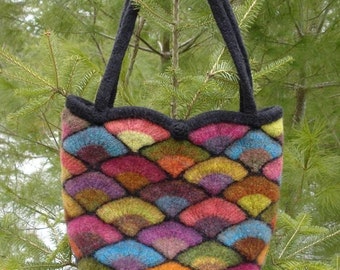 May include: A colourful knitted tote bag with a black handle and a scalloped top. The bag is made from a variety of different coloured yarns, including red, orange, yellow, green, blue, purple and brown.