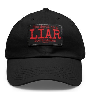 May include: Black baseball cap with a red patch that says "The devil is a LIAR Don't Listen John 8:44".
