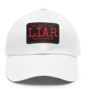 May include: White baseball cap with a black patch that says "The devil is a LIAR Don't Listen John 8:44".