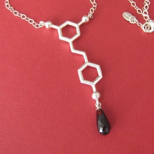 red wine resveratrol molecule necklace in solid sterling silver with garnet image 1