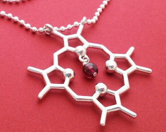 heme molecule necklace with garnet in solid sterling silver