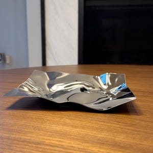 Tallrik rostfritt stål oregelbunden modern tallriksbricka