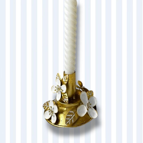 Brass candle holder with floral embellishments