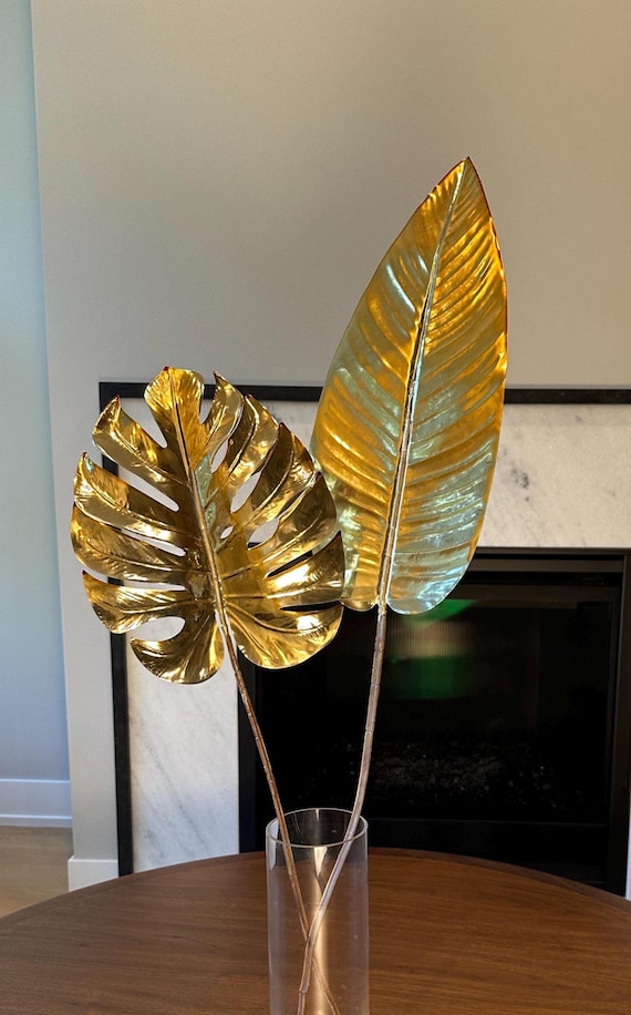 Two Oversized gold metallic style faux banana and monstera leaves