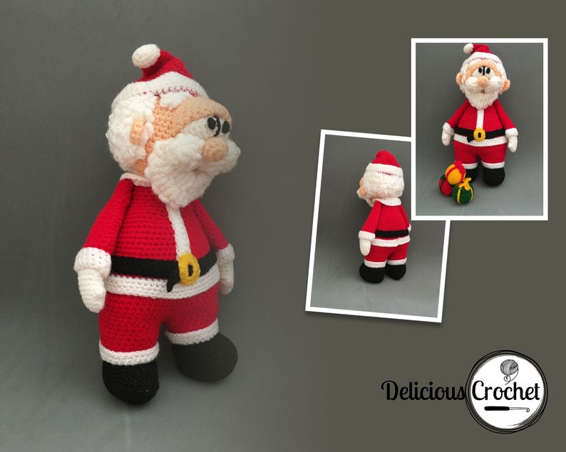 May include: A crocheted Santa Claus doll wearing a red suit with white trim, a black belt with a gold buckle, and a white beard. The doll is standing on a grey surface.