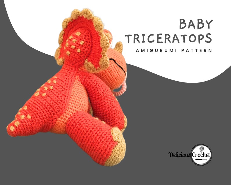 DeliciousCrochet Baby Triceratops. This is a crochet pattern, not the finished toy. Using DK or Sports acrylic yarn with a 2.5 mm hook, the dinosaur stands 7.5 inches tall. Instructions available in English (US) or Spanish.