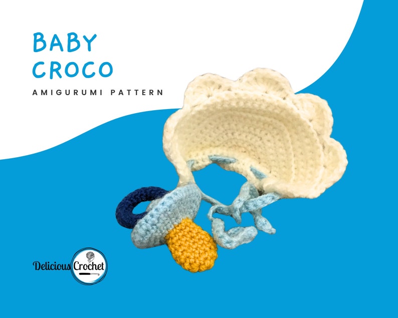 DeliciousCrochet Baby Croco. This is a crochet pattern, not the finished toy. Using DK or Sports acrylic yarn with a 2.5 mm hook, the croco is 16 inches long. Baby cap and pacifier are removable. Instructions available in English (US) or Spanish.