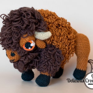 DeliciousCrochet American Bison (Buffalo). This is a crochet pattern, not the finished toy. Using DK or Sports acrylic yarn with a 2.5 mm hook, the toy stands 7.5 inches tall and 9 inches long. Instructions available in English (US) or Spanish.