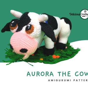 DeliciousCrochet Aurora the Cow. This is a crochet pattern, not the finished toy. Using DK or Sports acrylic yarn with a 2.5 mm hook, the cow is 6.5 inches tall & 10 inches long; lawn 12 inches wide. Instructions available in English (US) or Spanish.