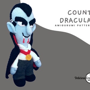 Puede incluir: Patrón de amigurumi de crochet de Conde Drácula. Un vampiro de crochet azul con una capa roja, una camisa blanca y pantalones negros. El patrón está disponible para su compra.