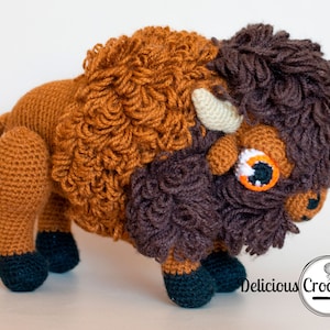 DeliciousCrochet American Bison (Buffalo). This is a crochet pattern, not the finished toy. Using DK or Sports acrylic yarn with a 2.5 mm hook, the toy stands 7.5 inches tall and 9 inches long. Instructions available in English (US) or Spanish.