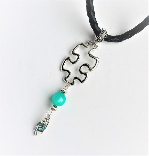 Autism Puzzle and Blue Parrot Necklace Beaded Pendant with Blue Fiber Glass Bead Black Leatherette Necklace Gift for her by enchantedbeads
