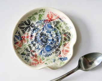 Colorful spoon rest, glazed in boho design on ivory white