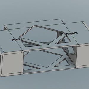 May include: A light gray, rectangular insert with the text "Network Insert" printed on the top. The insert has a geometric design with triangular and diamond-shaped cutouts. The design is 3D rendered.
