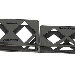 May include: A grey metal rack mount with the text "NetworkBuck" and "UCG-FIBER". The rack has a geometric design with diamond-shaped cutouts. It is designed to hold network equipment.