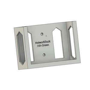 May include: A light grey rectangular bracket with cut-out sections and the text "NetworkBuck HA-Green". The bracket has two vertical, elongated openings and a central rectangular opening. Two small holes are visible.