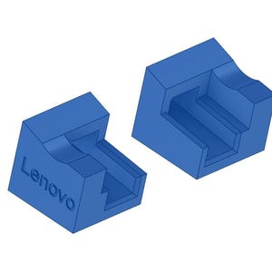 May include: Two blue, geometric, 3D-printed objects. One has the brand name "Lenovo" printed on it. The objects have a stepped design with curved and rectangular features. They are set against a white background.