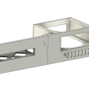 May include: A light gray, three-dimensional, rectangular electronic component with multiple openings and a series of small, rectangular cutouts. The component has a rectangular opening and a series of holes along the edges.