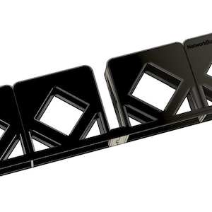 May include: Black plastic cable management system with the text "NetworkDuck" on the side. The system has four slots for organizing cables.