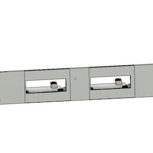 May include: A light gray rack mount component with two rectangular openings. Each opening contains a small, dark-colored object. The component has rounded corners and four mounting holes.