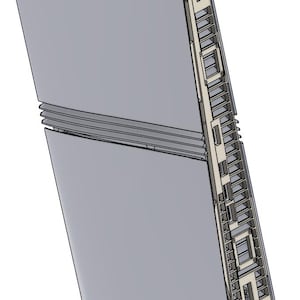 Pode incluir: Um dispositivo eletrônico cinza claro com um painel lateral aberto. O dispositivo possui linhas horizontais e um lado detalhado com aberturas retangulares. O design geral é moderno e elegante.