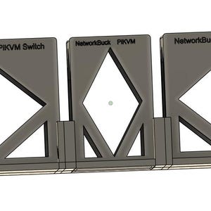 May include: Three gray metal PKVM Switch components with diamond-shaped cutouts and the text "NetworkBuck" printed on the top. The components are connected at the base and stand upright.