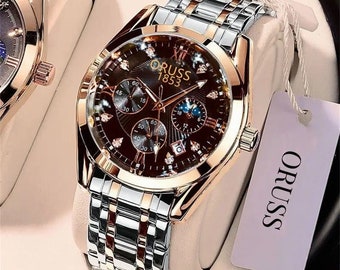 Bekijk het Oruss zilver- en goudkleurige luxe waterdichte Glow-horloge voor heren