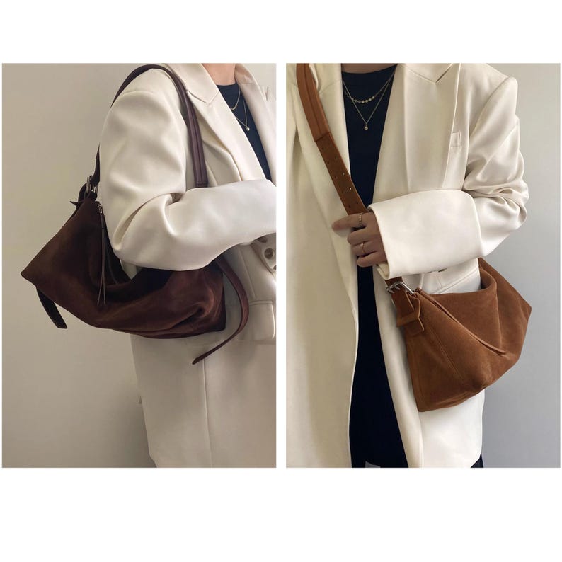 May include: Two suede shoulder bags in different shades of brown. One bag is a darker brown with a long strap, and the other is a lighter brown with a shorter strap. Both bags have a soft, slouchy design.