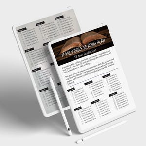 May include: A white tablet with a black stylus pen on top of it. The tablet screen displays a yearly Bible reading plan with a 52-week schedule. The plan includes daily readings from the Old and New Testaments, Psalms, and Proverbs. The screen also shows a close-up of an open Bible.