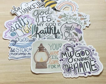 May include: A collection of colorful stickers with religious quotes and imagery. The stickers feature phrases like "Be Salt & Light", "My God is Faithful", "Your Word is My Lamp", and "My God Knows My Name".