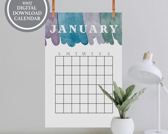 May include: A blank 11x17 digital download calendar for January, featuring watercolor strokes in shades of blue, green, and purple. The word "JANUARY" is printed in large white letters above a grid for the days of the month.