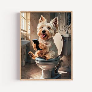 May include: A framed print featuring a West Highland White Terrier sitting on a toilet, holding a smartphone. The dog has a happy expression. The bathroom setting includes a sink and window, with a light color palette.